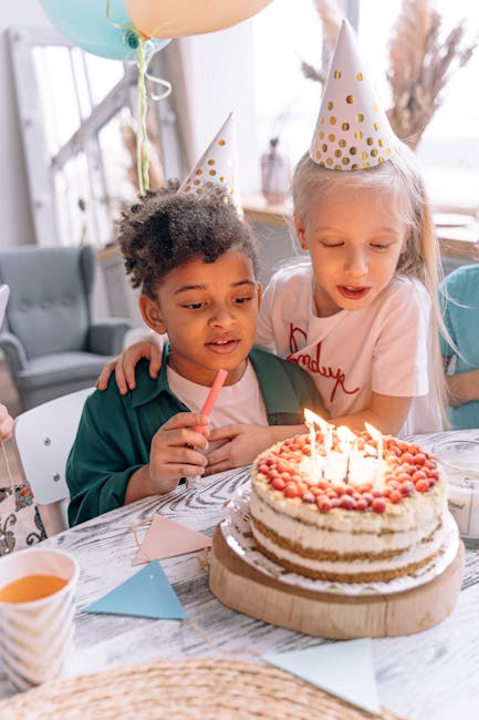 Child blowing out birthday candles