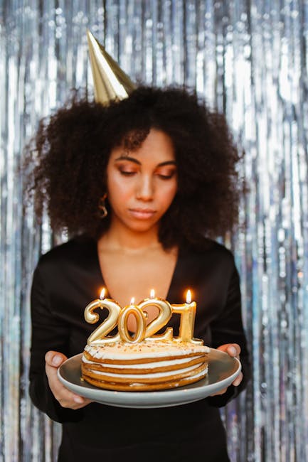 Woman holding a cake for the year 2021